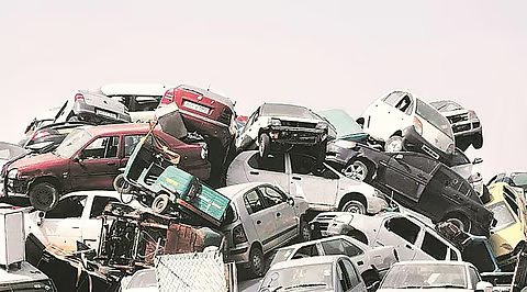 End-of-life cars stacked at a vehicle scrapping facility